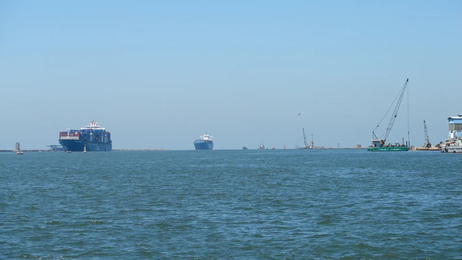 Ships at the northern entrance of the Suez Canal at Port Said, Egypt.